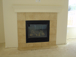 The grouting finished around the fireplace.