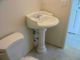 The pedestal sink in the downstairs bathroom.