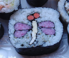 A dragonfly with carrot eyes and a piece of omelette for the body.